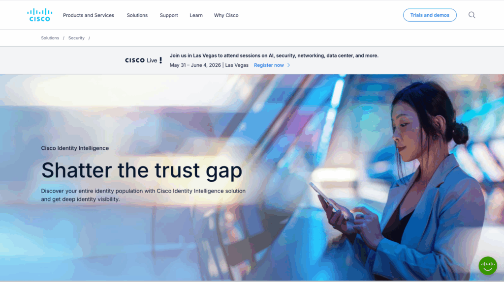 A woman in business attire uses her smartphone while standing indoors next to a glass wall. Text on the image reads, Shatter the trust gap and promotes Cisco Identity Intelligence solutions.